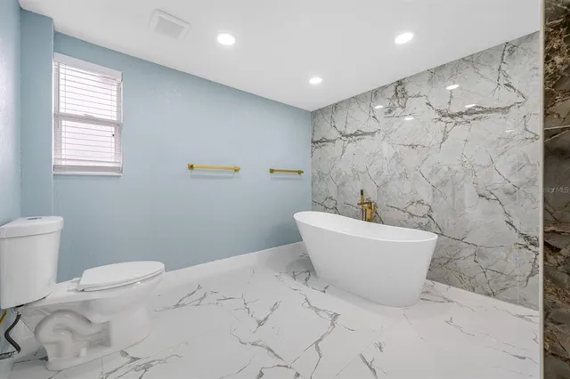 a view of an empty room and a window