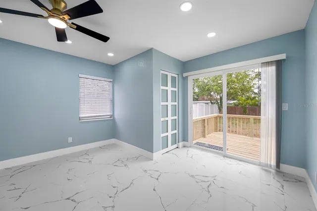 a view of an empty room with a window