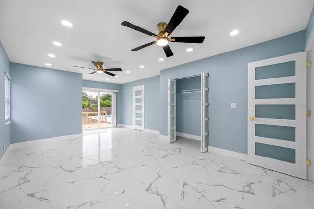 a view of an empty room and a window