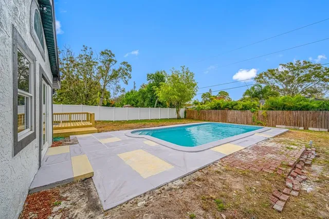a view of backyard with green space