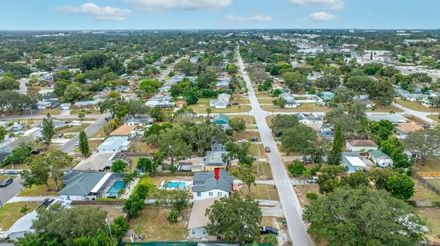 an aerial view of a house with a garden