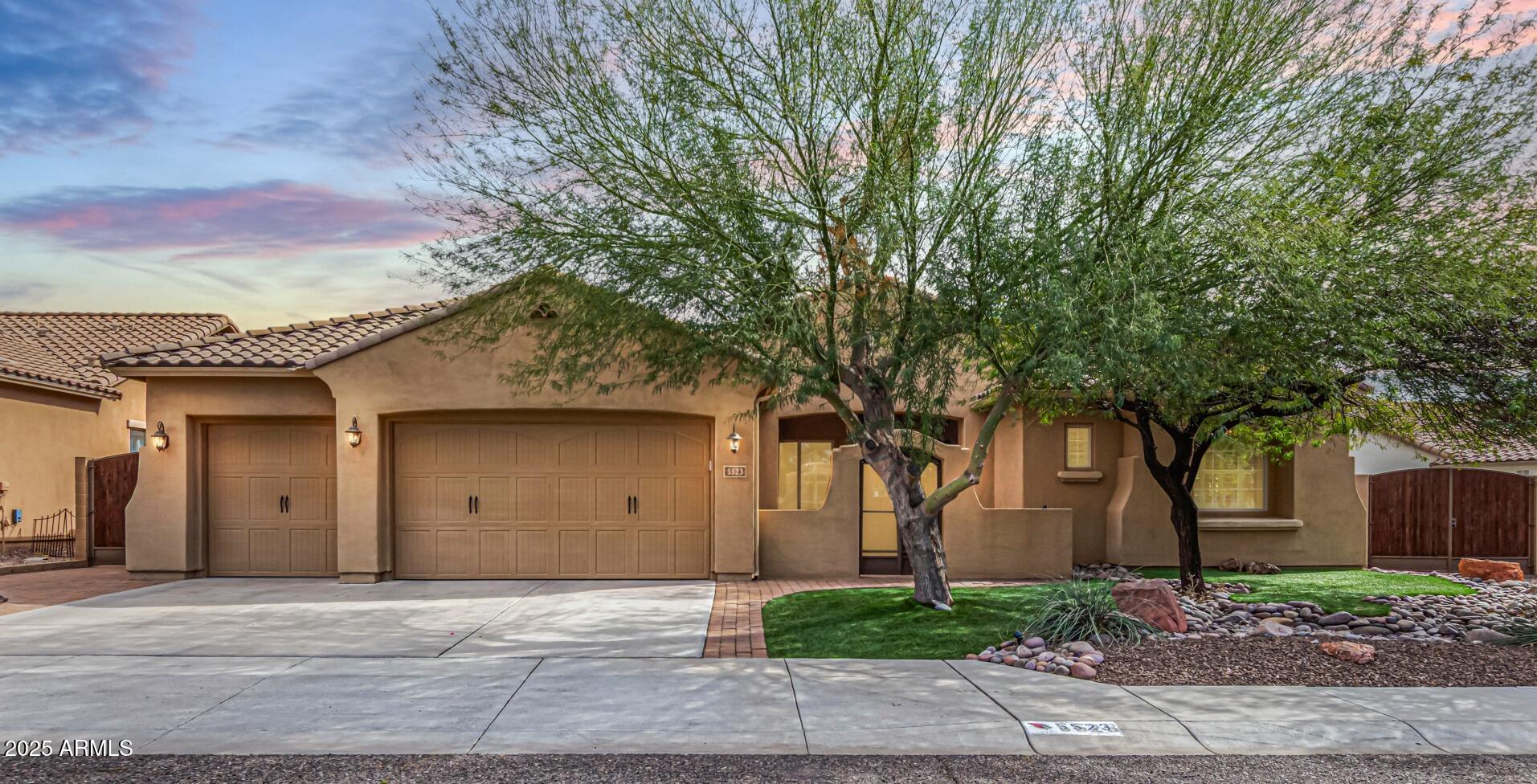 front view of a house with a yard