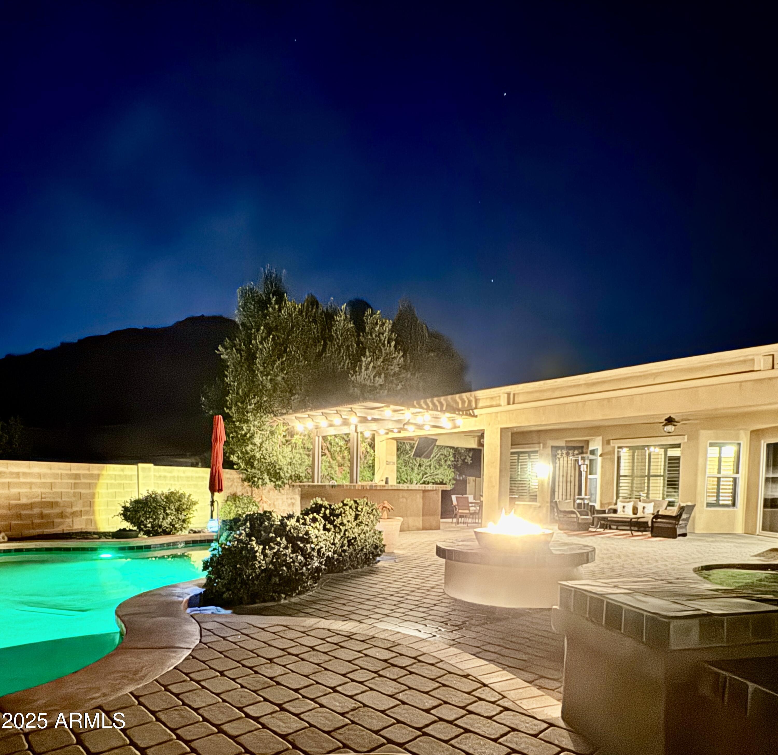 5523 West Yearling Road Phoenix, AZ 85083 - Photo 15 of 54 a view of a patio with table and chairs potted plants