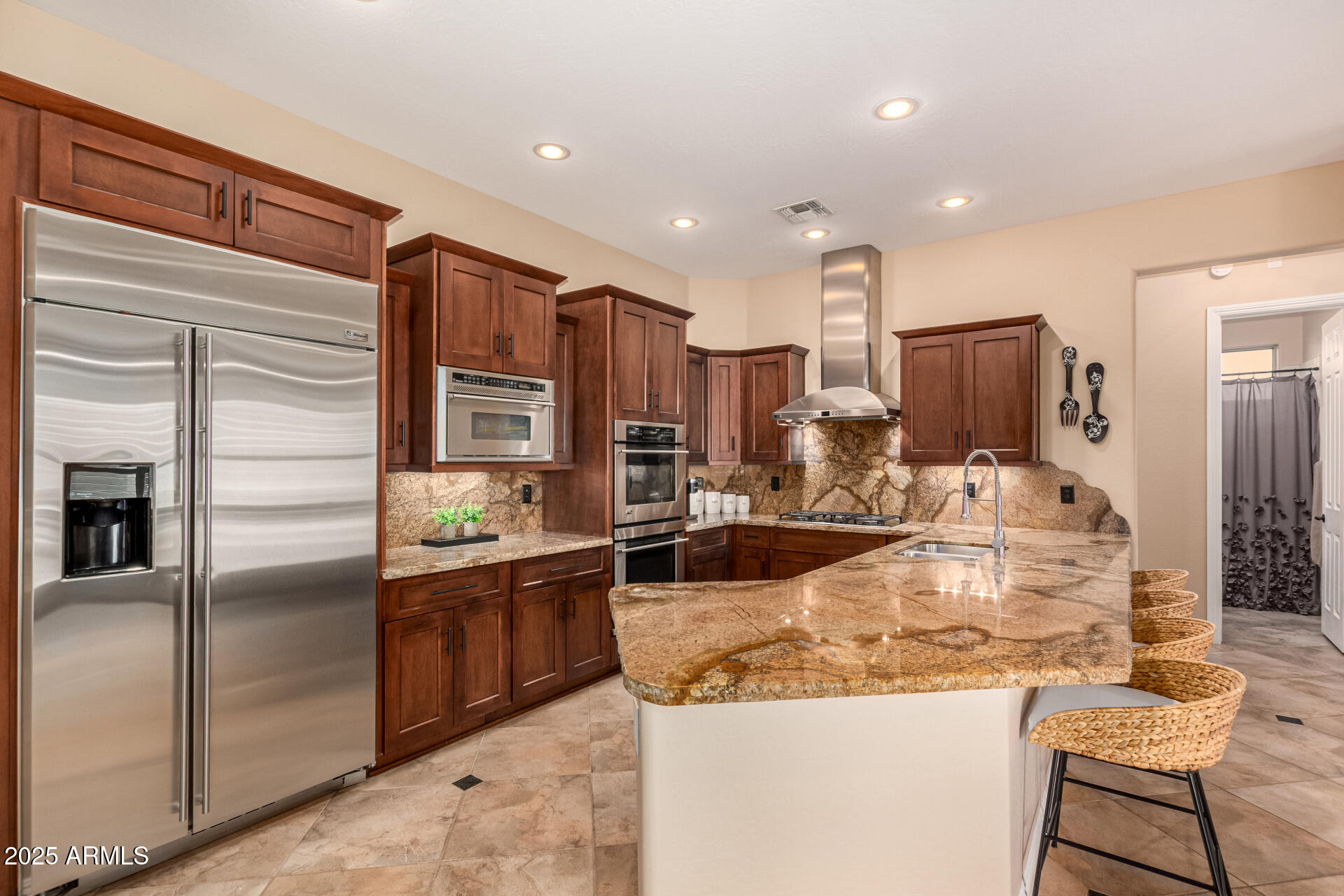 5523 West Yearling Road Phoenix, AZ 85083 - Photo 18 of 54 a kitchen with stainless steel appliances granite countertop a sink and refrigerator