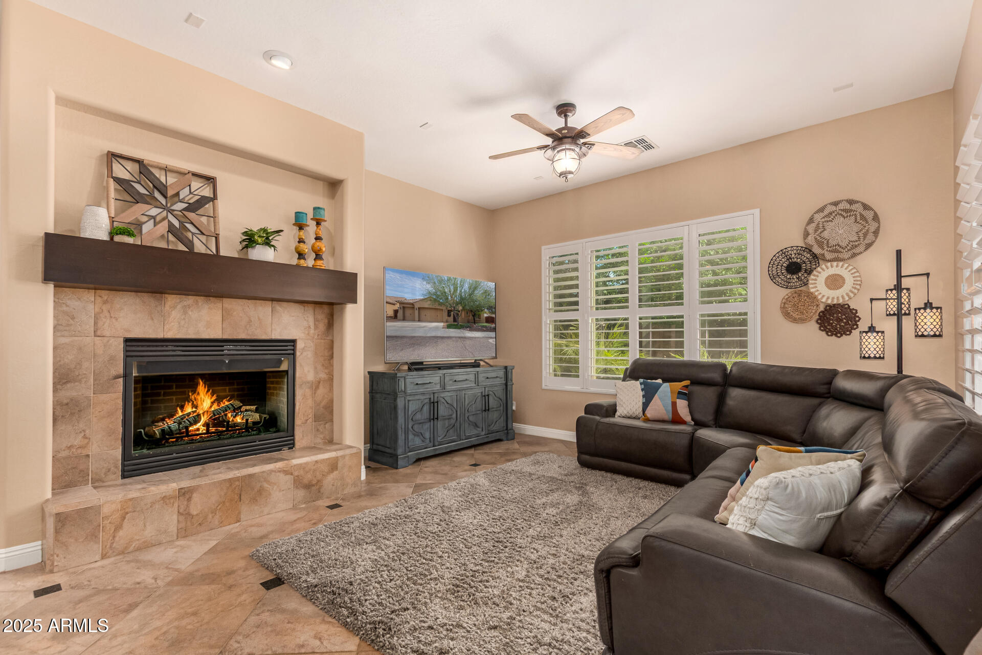 5523 West Yearling Road Phoenix, AZ 85083 - Photo 20 of 54 a living room with furniture and a fireplace
