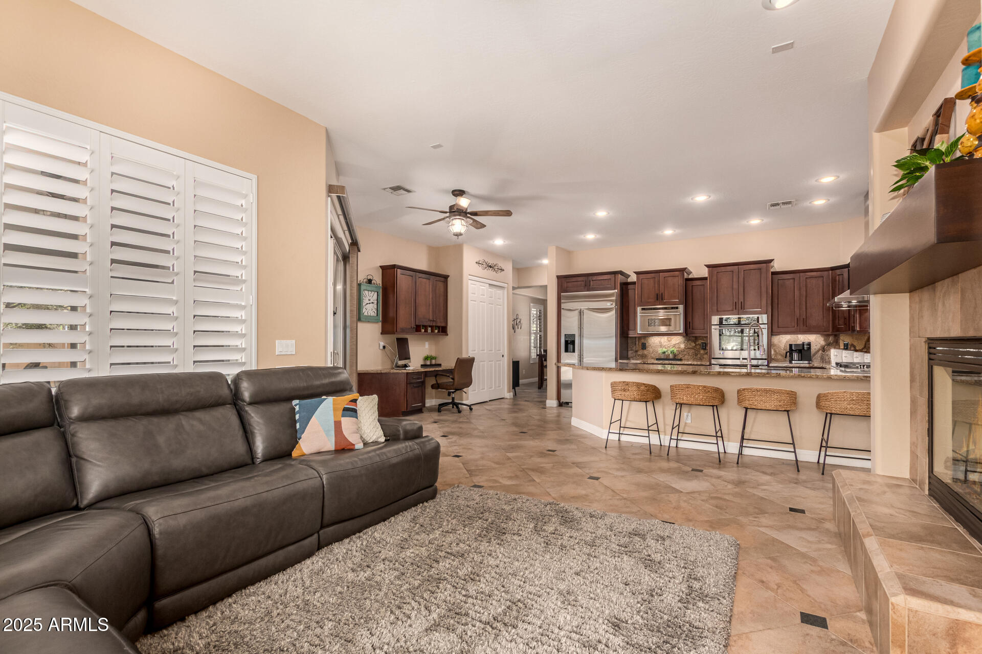 5523 West Yearling Road Phoenix, AZ 85083 - Photo 21 of 54 a living room with furniture and a large window