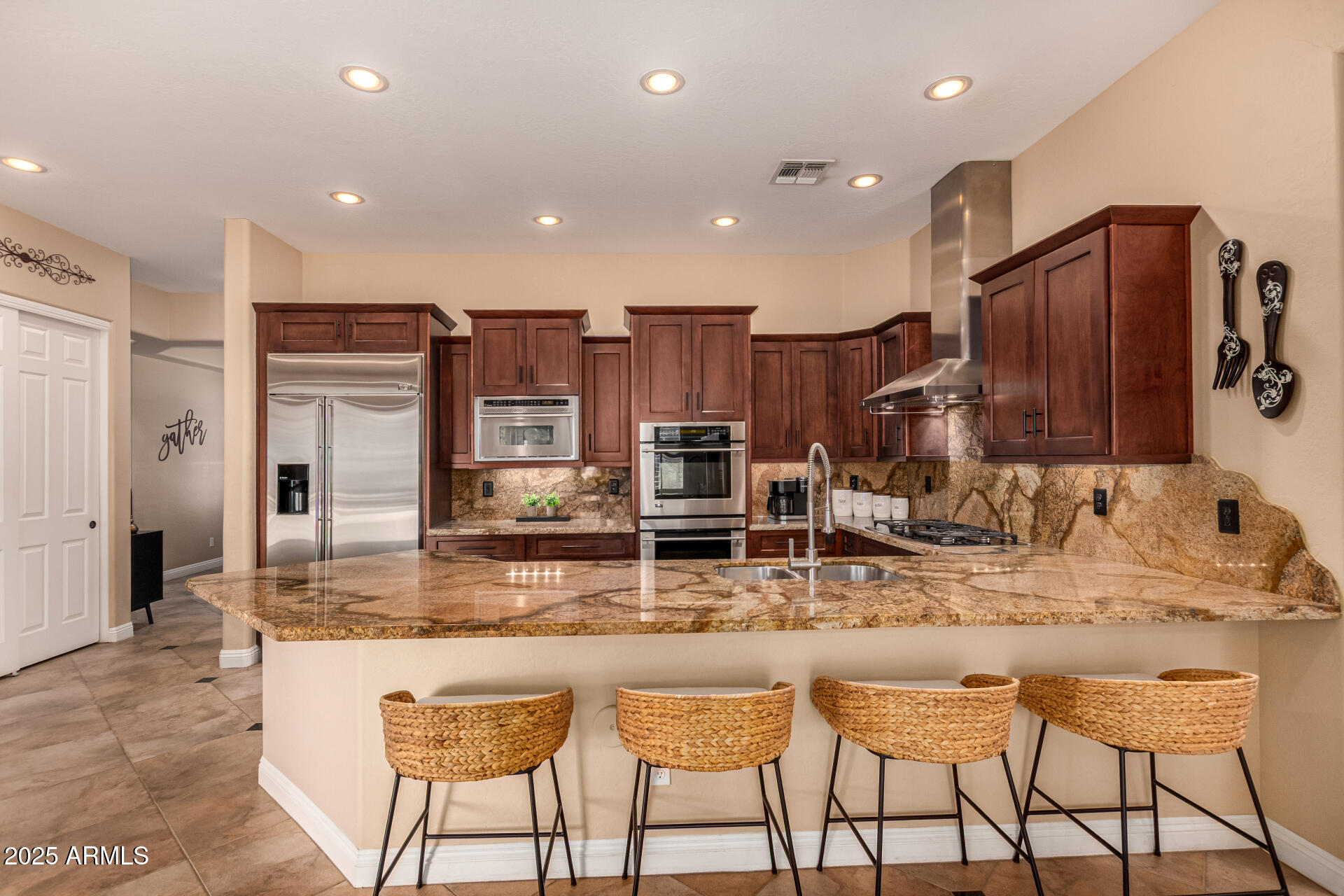 5523 West Yearling Road Phoenix, AZ 85083 - Photo 23 of 54 a kitchen with kitchen island granite countertop wooden cabinets and granite counter tops