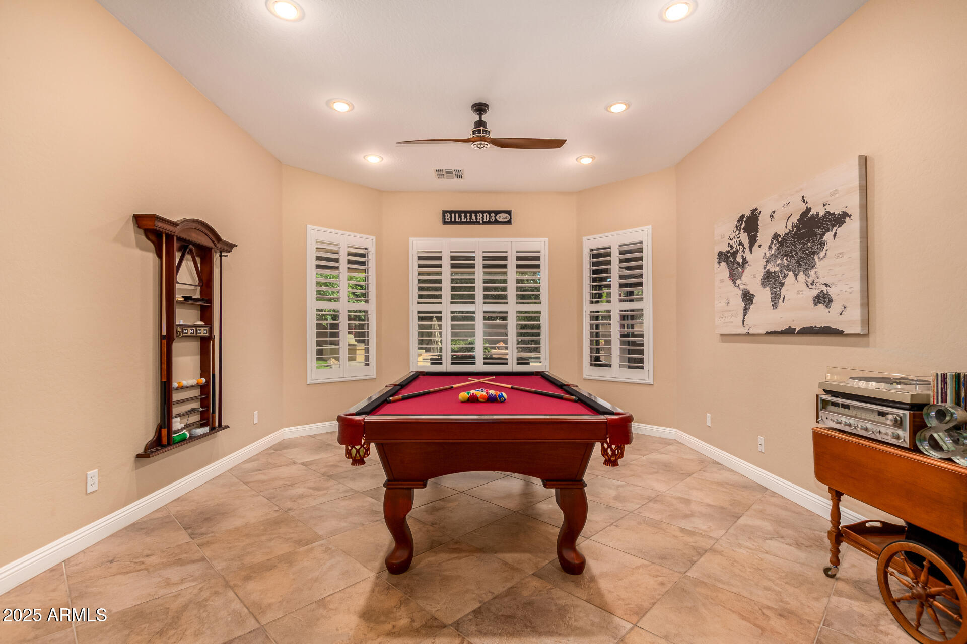 5523 West Yearling Road Phoenix, AZ 85083 - Photo 25 of 54 a living room with furniture a window and a flat screen tv