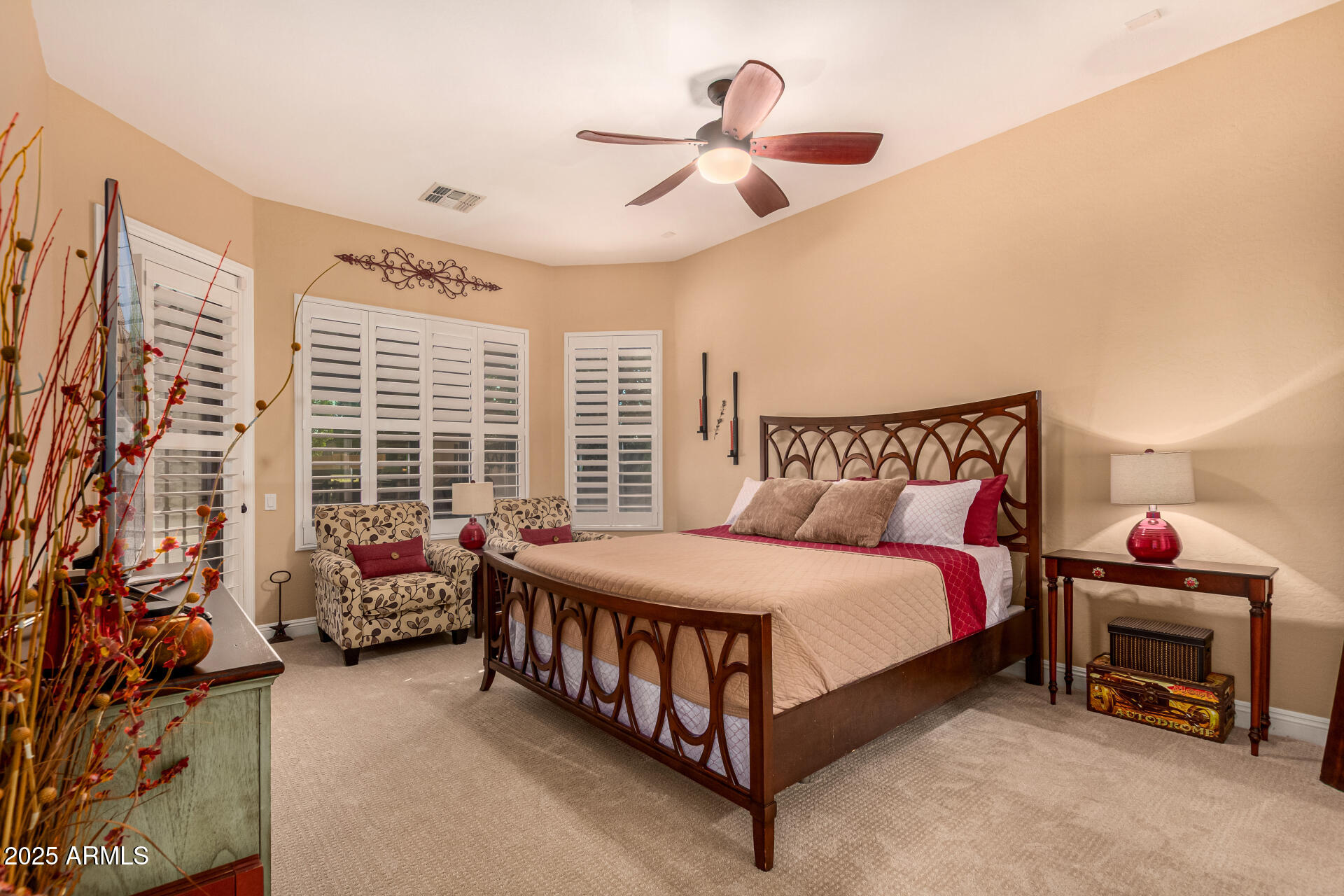 5523 West Yearling Road Phoenix, AZ 85083 - Photo 29 of 54 a bedroom with a bed and a chandelier