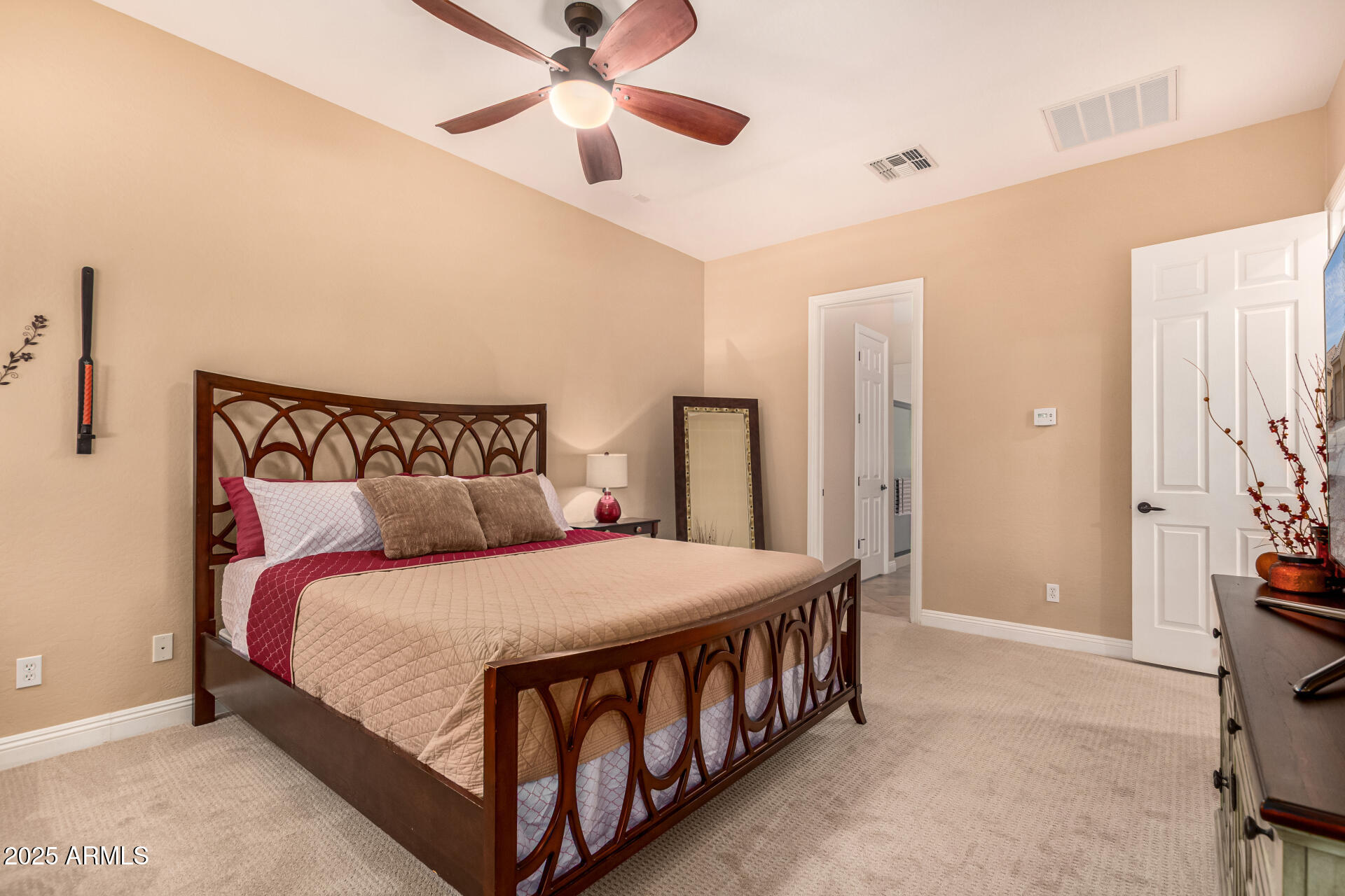 5523 West Yearling Road Phoenix, AZ 85083 - Photo 30 of 54 a bedroom with a bed and a chandelier