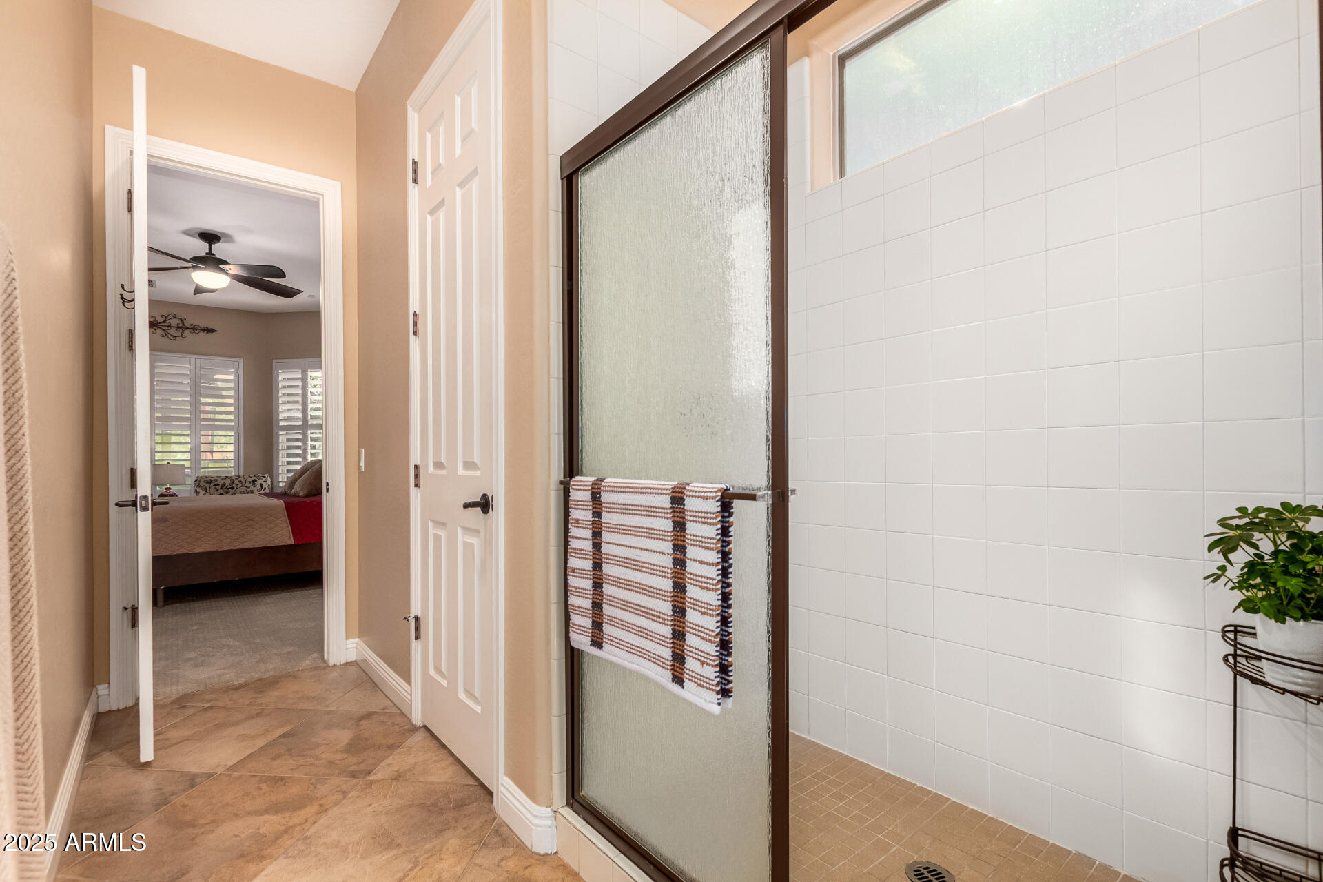 5523 West Yearling Road Phoenix, AZ 85083 - Photo 32 of 54 a view of a hallway with a livingroom and couch