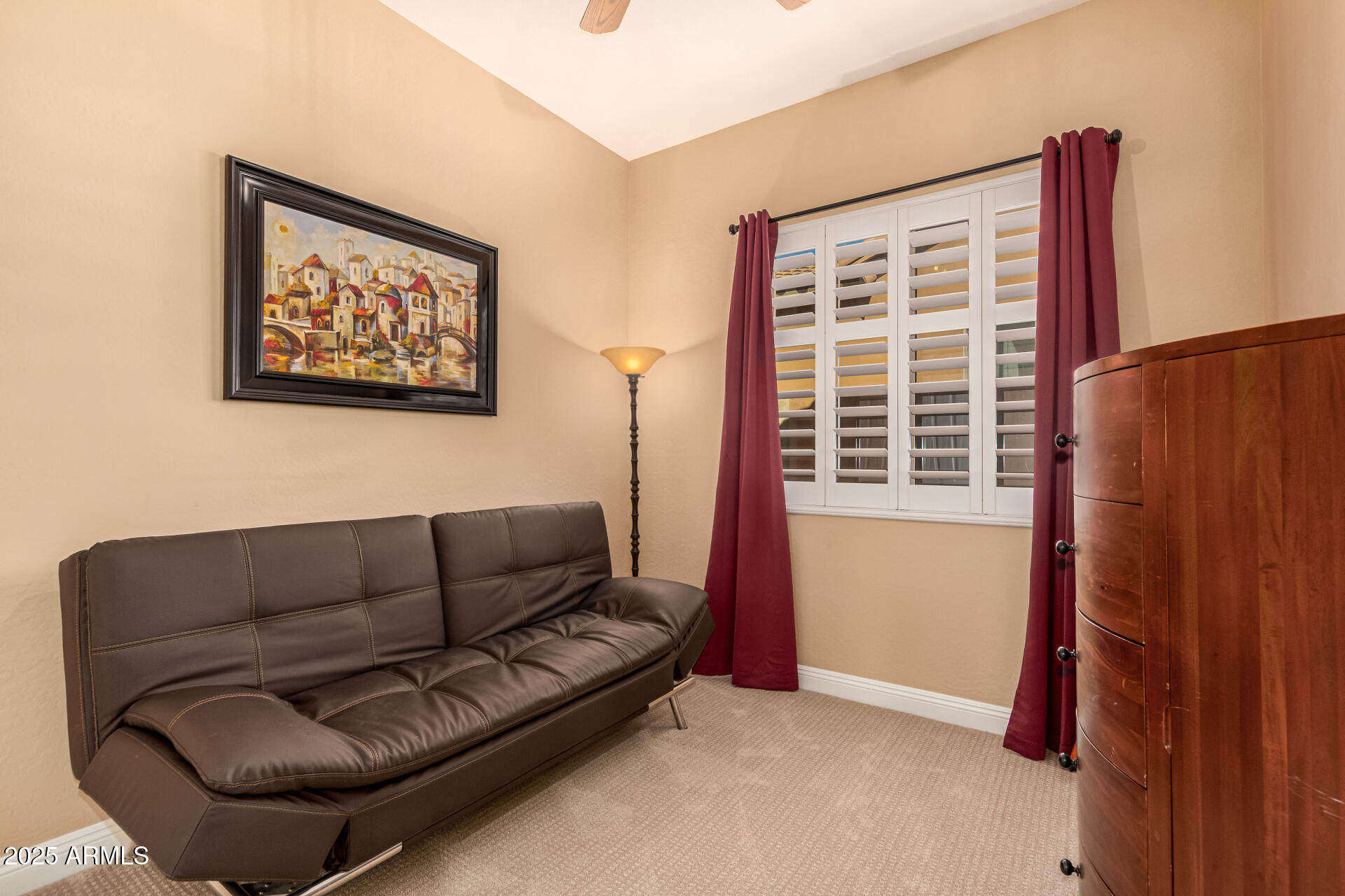 5523 West Yearling Road Phoenix, AZ 85083 - Photo 35 of 54 a living room with furniture and a window