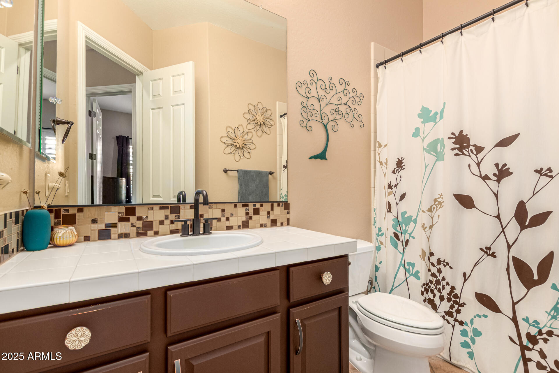 5523 West Yearling Road Phoenix, AZ 85083 - Photo 37 of 54 a bathroom with a sink and a mirror
