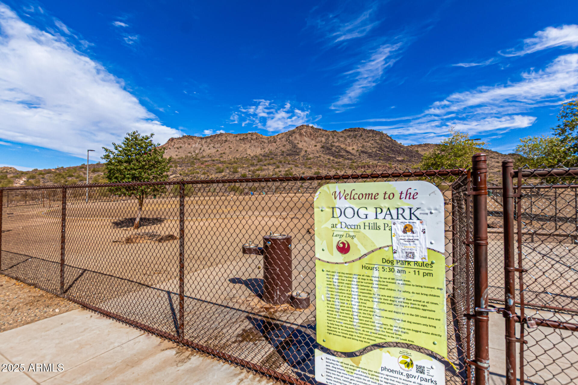 5523 West Yearling Road Phoenix, AZ 85083 - Photo 53 of 54 a view of a tennis court with a sign board