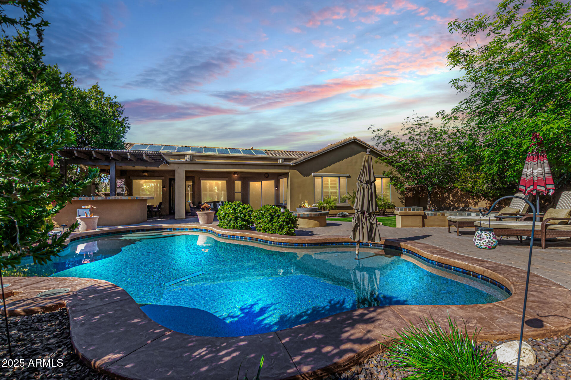5523 West Yearling Road Phoenix, AZ 85083 - Photo 6 of 54 a view of a house with swimming pool and sitting area