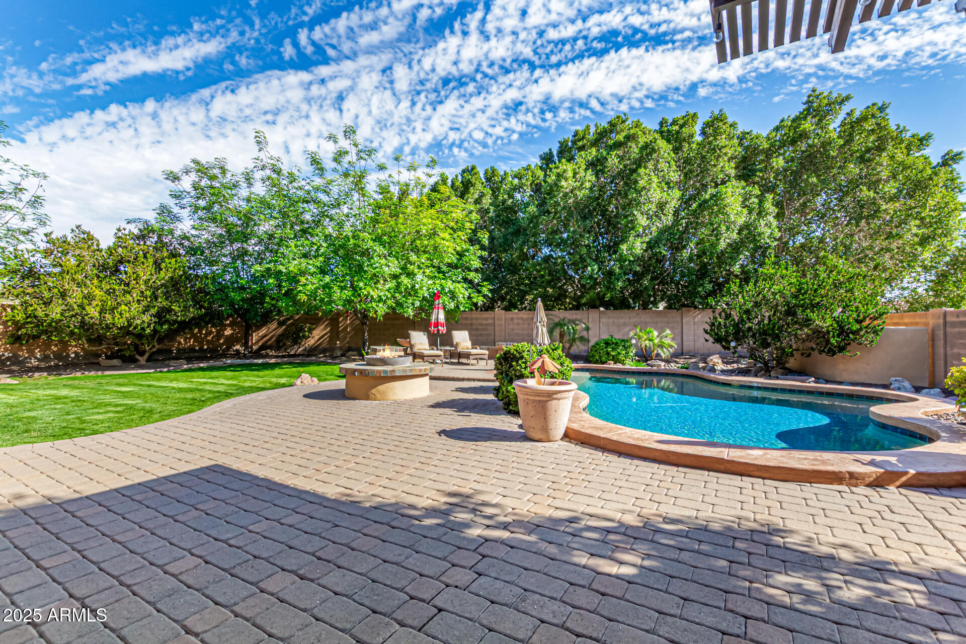 5523 West Yearling Road Phoenix, AZ 85083 - Photo 7 of 54 a view of a swimming pool with a patio