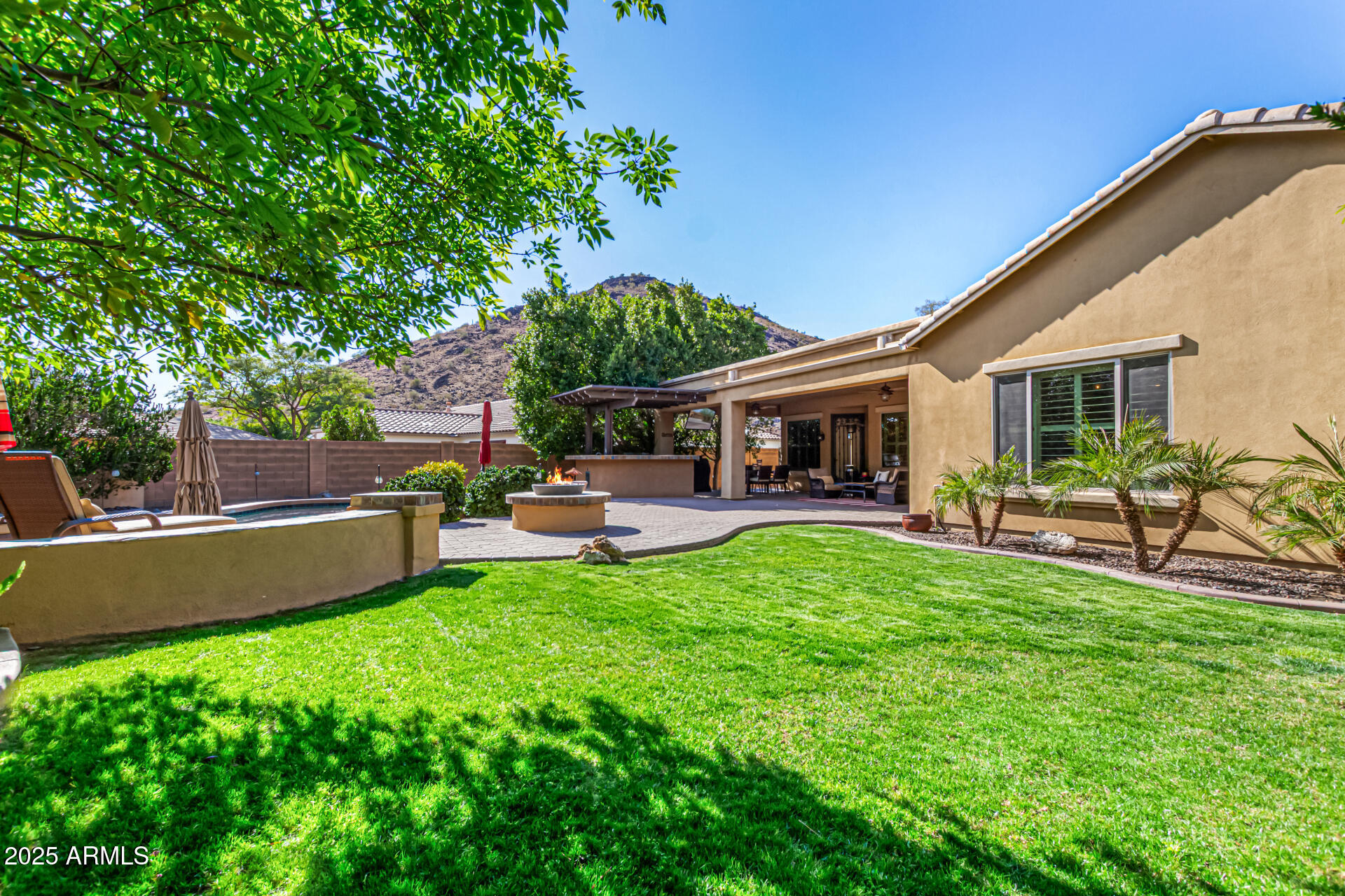 5523 West Yearling Road Phoenix, AZ 85083 - Photo 8 of 54 a view of a house with a backyard and a patio