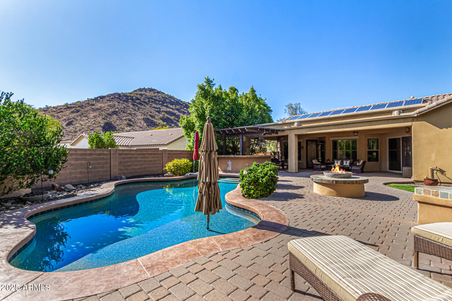 5523 West Yearling Road Phoenix, AZ 85083 - Photo 9 of 54 a view of a house with backyard swimming pool and sitting area
