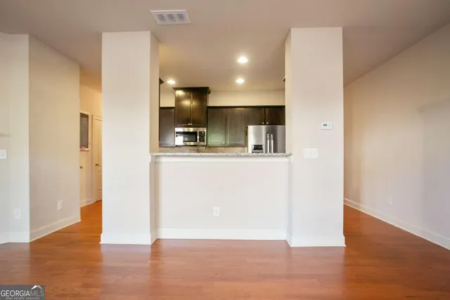 a view of kitchen with wooden floor