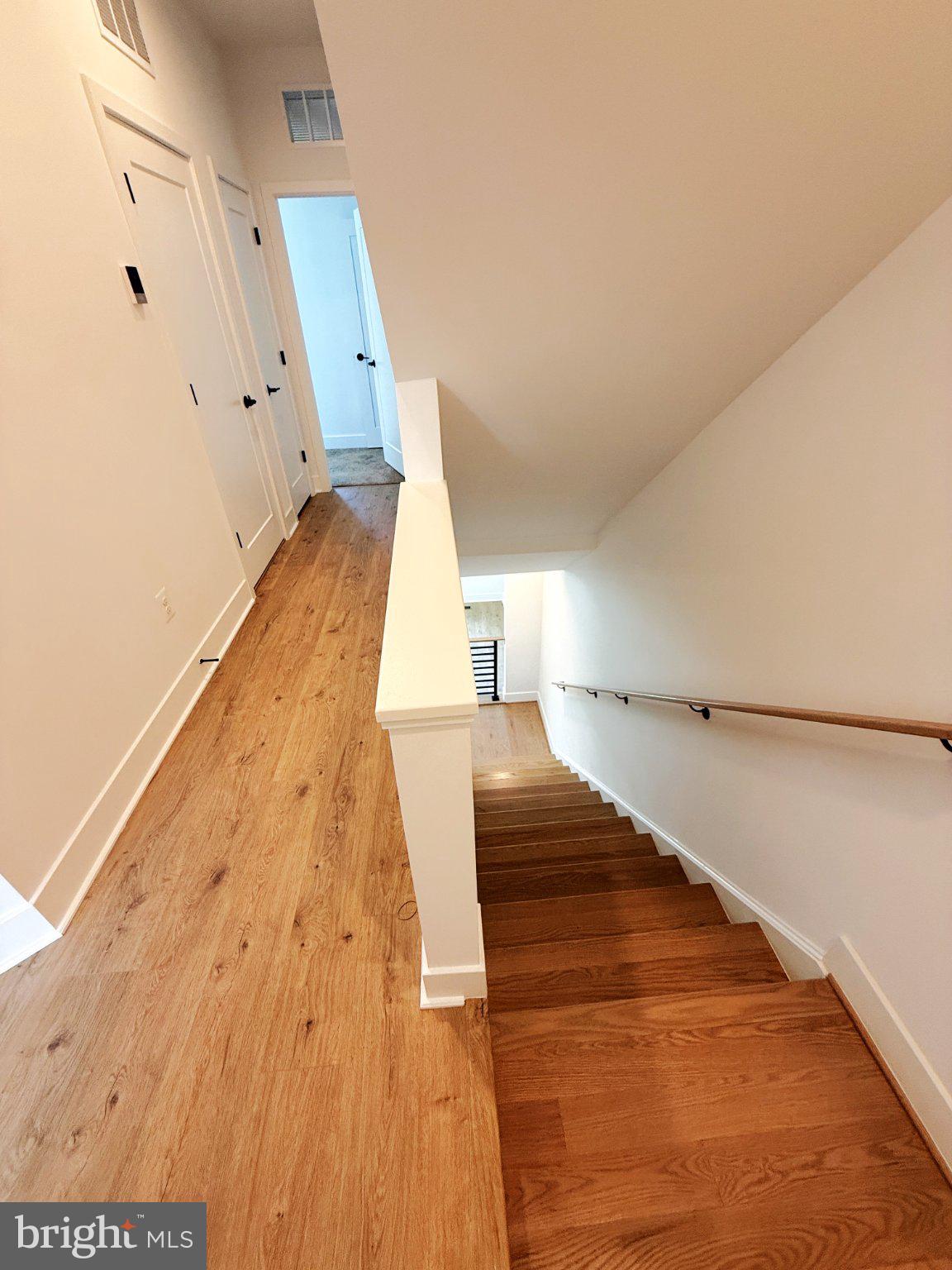 33 Lower Service Court Northwest Washington, DC 20001 - Photo 28 of 51 Inviting staircase with warm wood tones.