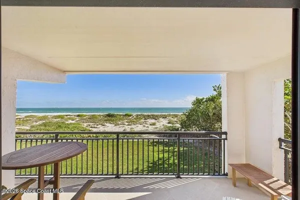 a view of balcony with furniture