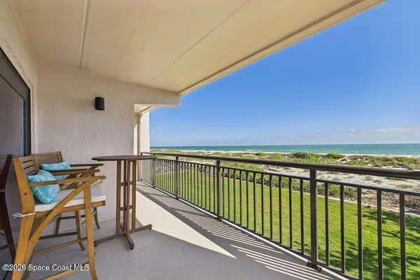 a view of a balcony with chairs