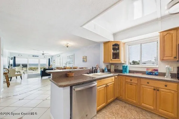 a kitchen with stainless steel appliances a stove sink microwave and cabinets