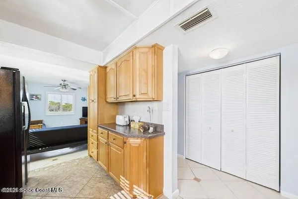 a kitchen with stainless steel appliances granite countertop a stove a sink dishwasher and a refrigerator