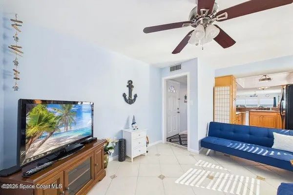 a view of a hallway with filled with furniture