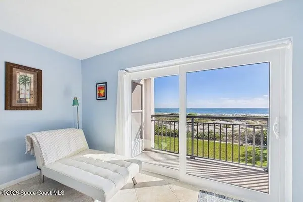 a view of balcony with wooden floor and fence