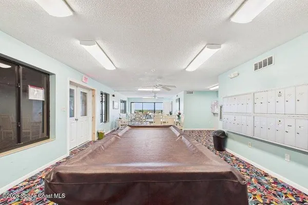 a view of a balcony with floor to ceiling window and stairs