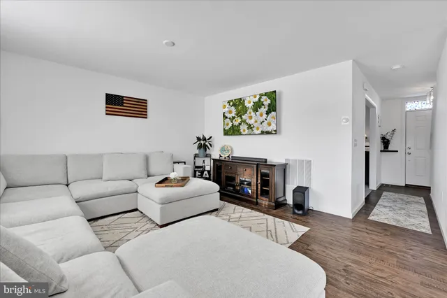 a bathroom with a granite countertop sink a toilet and a mirror