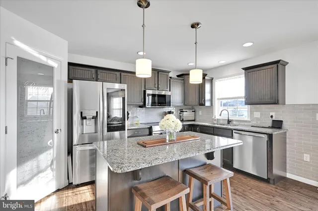 a bathroom with a sink a mirror and a toilet