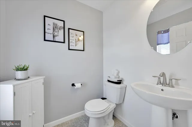 a utility room with sink dryer and washer