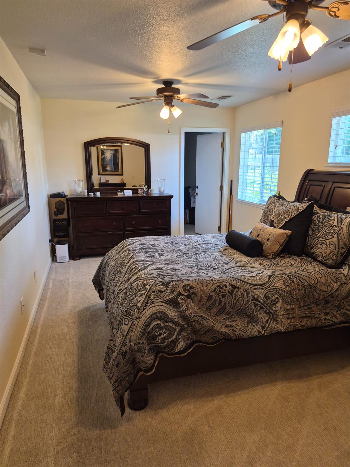 5817 Keyntel Street Citrus Heights, CA 95621 - Photo 10 of 30 a bedroom with a large bed and a tv