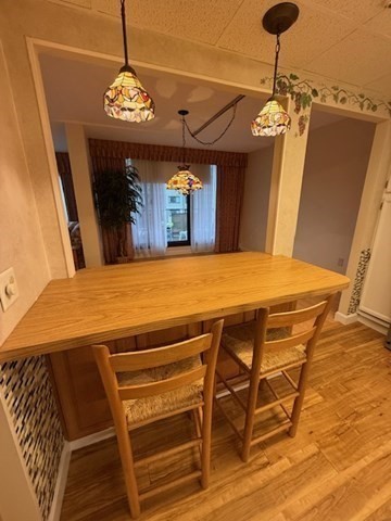 73 Broad Reach, Unit M36C Weymouth, MA 02191 - Photo 11 of 31 a view of a dining room with furniture and wooden floor