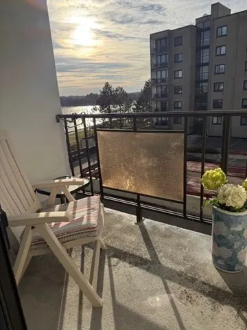 a view of a city with tall buildings and ocean view