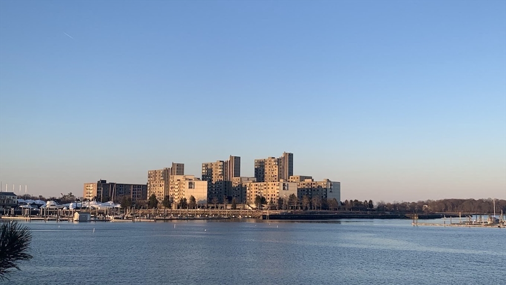 73 Broad Reach, Unit M36C Weymouth, MA 02191 - Photo 27 of 31 a view of a city with tall buildings and ocean view