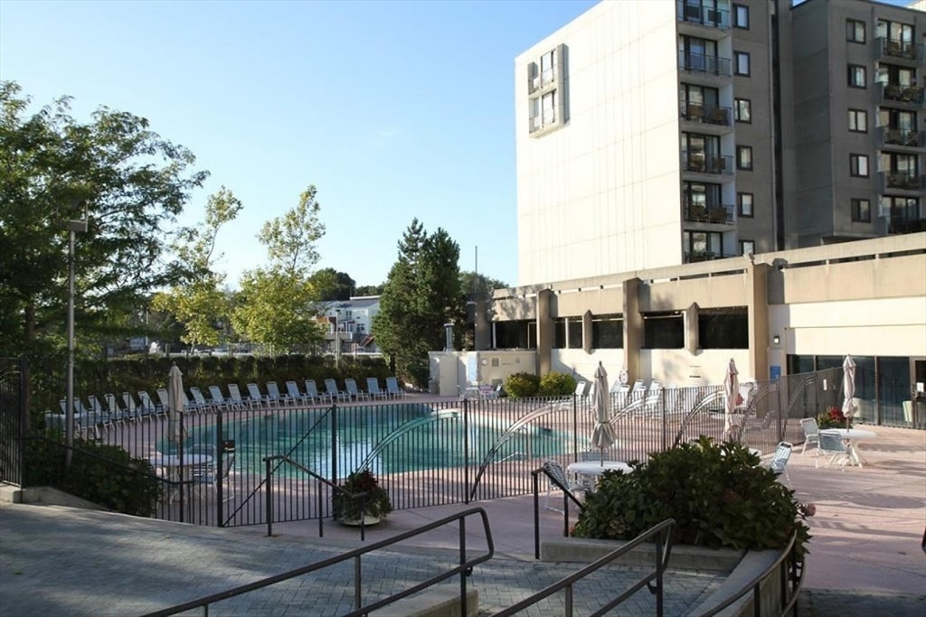 73 Broad Reach, Unit M36C Weymouth, MA 02191 - Photo 30 of 31 a view of a patio with couches table and chairs and potted plants