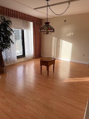 73 Broad Reach, Unit M36C Weymouth, MA 02191 - Photo 4 of 31 a view of a livingroom with a white furniture wooden floor and a ceiling fan