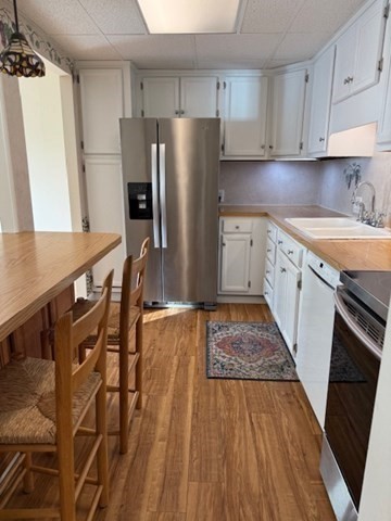 73 Broad Reach, Unit M36C Weymouth, MA 02191 - Photo 9 of 31 a kitchen with granite countertop a refrigerator stove and sink