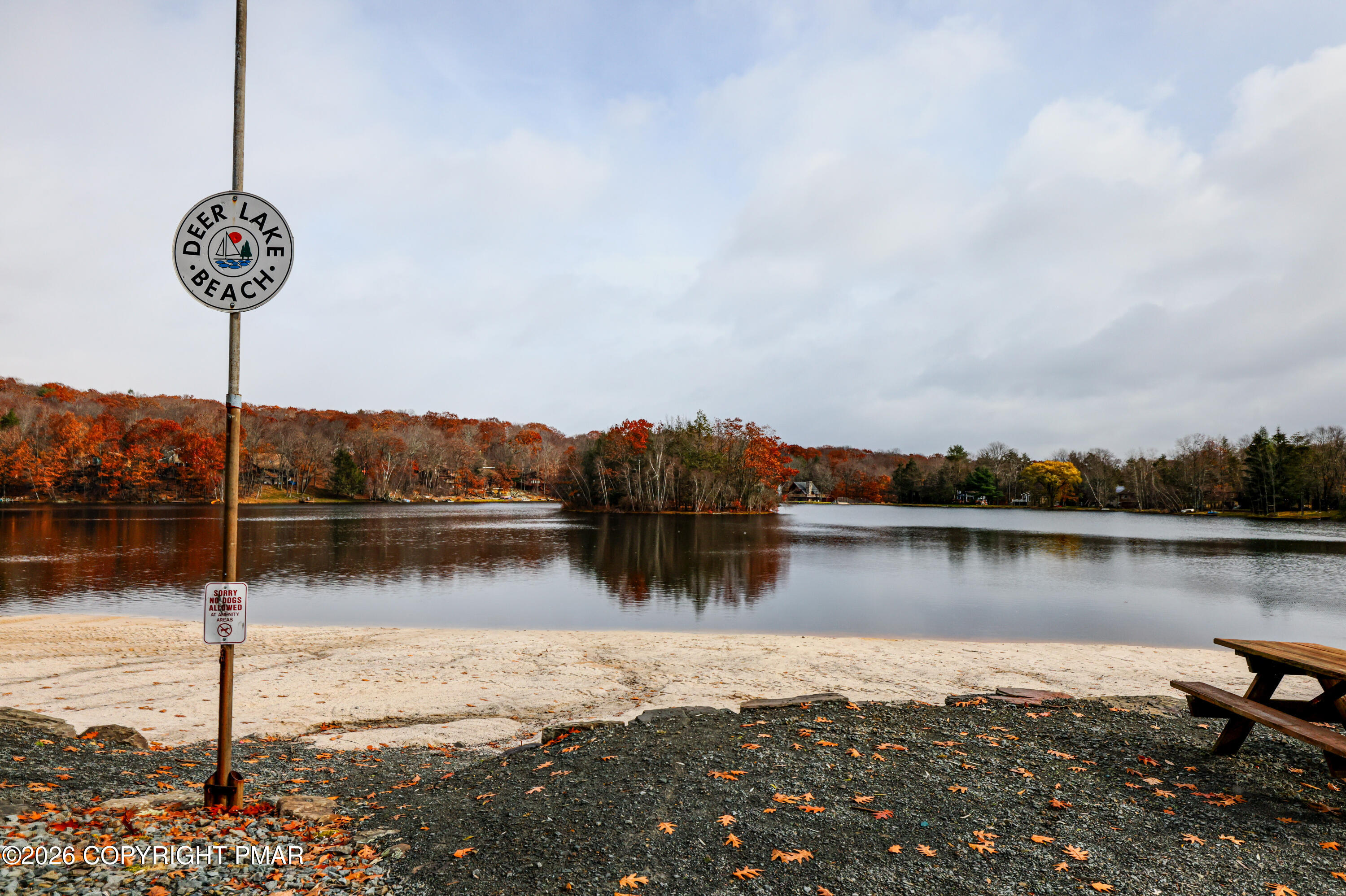 2137 Freedom Way Pocono Summit, PA 18346 - Photo 68 of 71 a view of a lake with a table and chairs