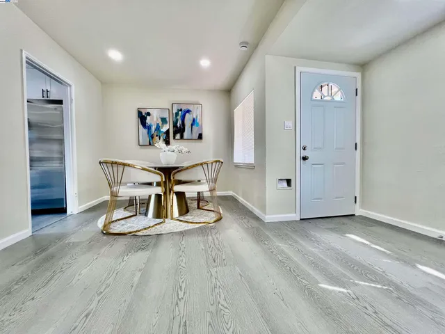 a view of kitchen with furniture and chandelier
