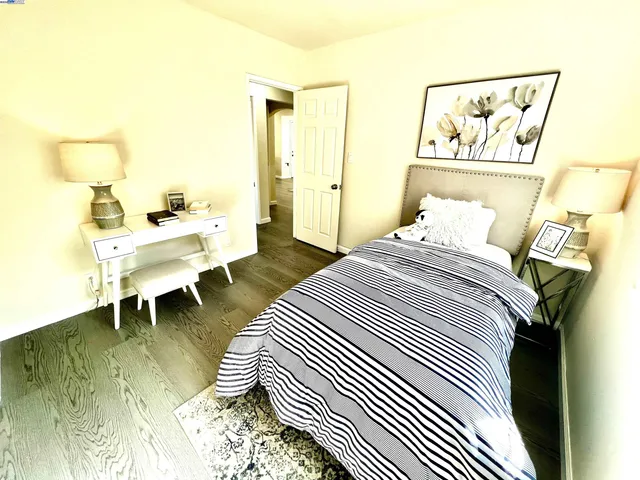 a bedroom with a bed and a table in it