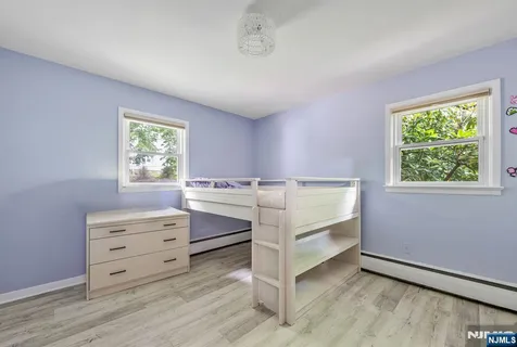 a view of room with window and cabinet