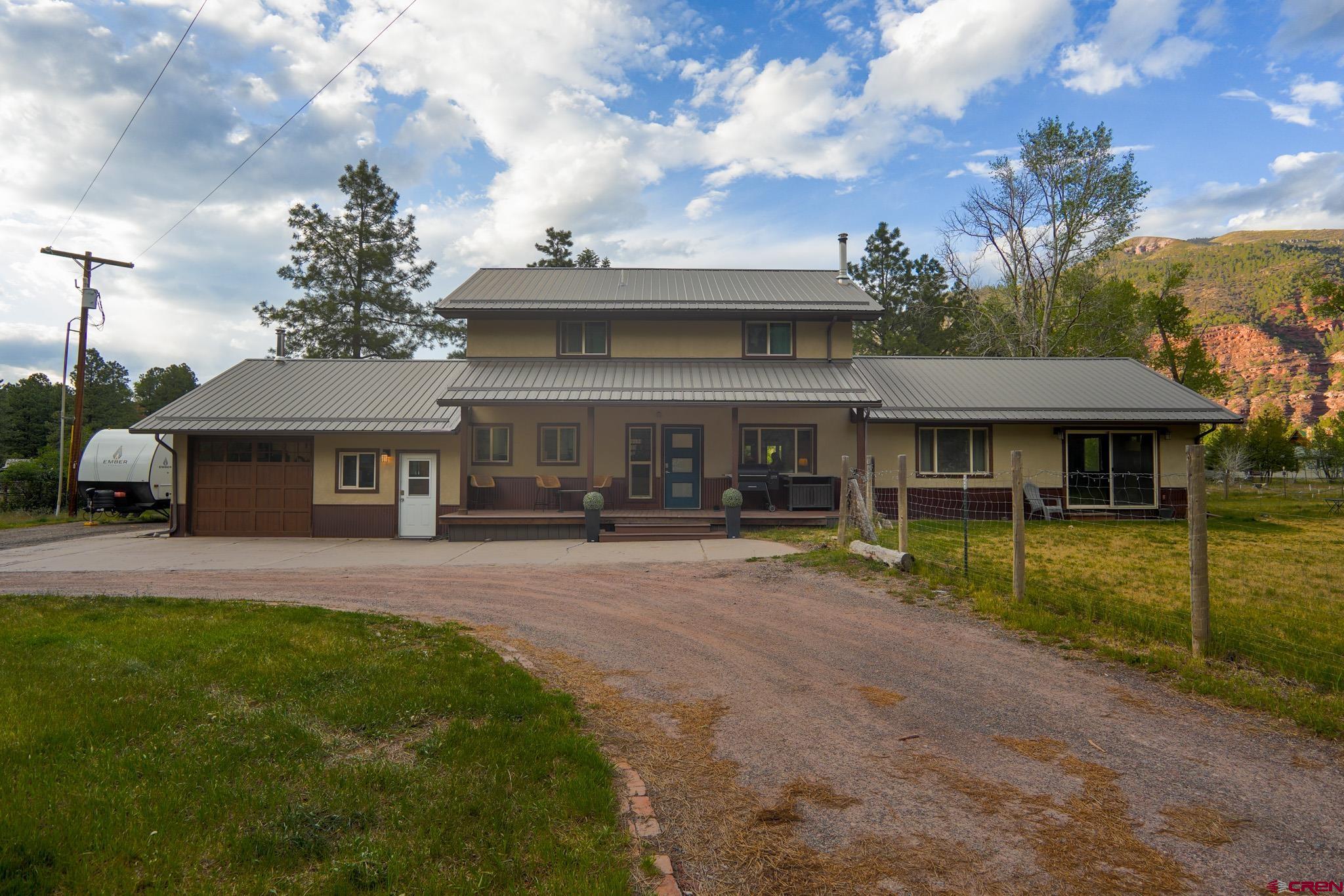 559 Suzanne Lane Ridgway, CO 81432 - Photo 40 of 45 a front view of a house with a garden
