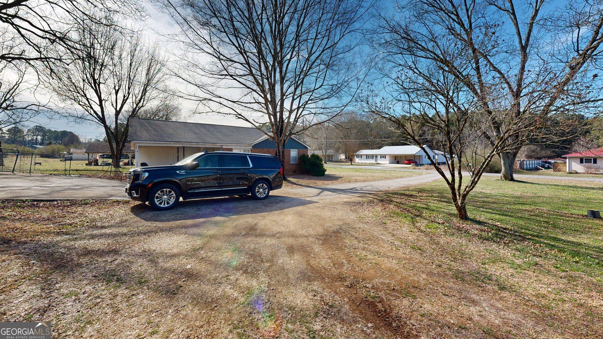 189 Boyd Valley Road Southeast Rome, GA 30161 - Photo 12 of 32 a view of a yard with a car parked in front of it