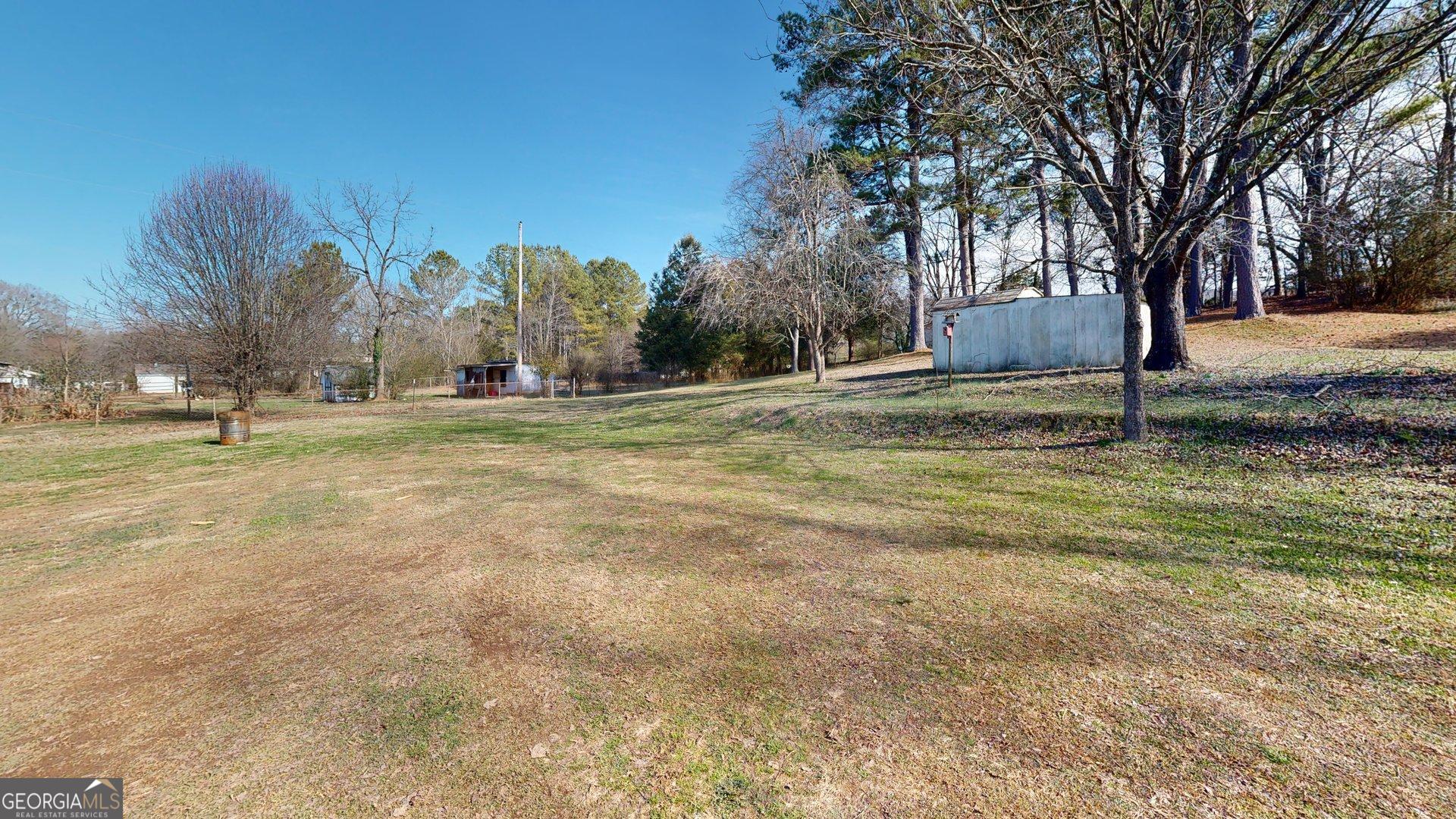 189 Boyd Valley Road Southeast Rome, GA 30161 - Photo 17 of 32 a yard with trees and a building