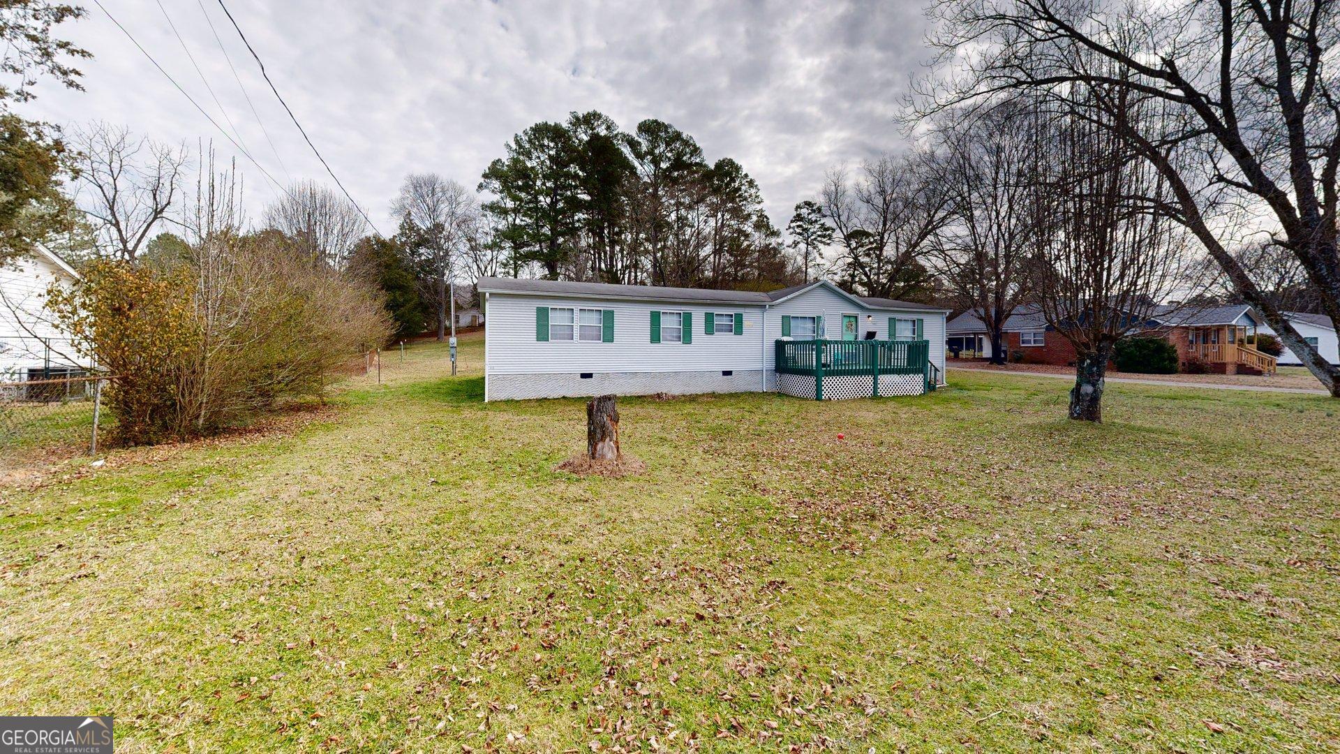 189 Boyd Valley Road Southeast Rome, GA 30161 - Photo 2 of 32 a house view with a garden space