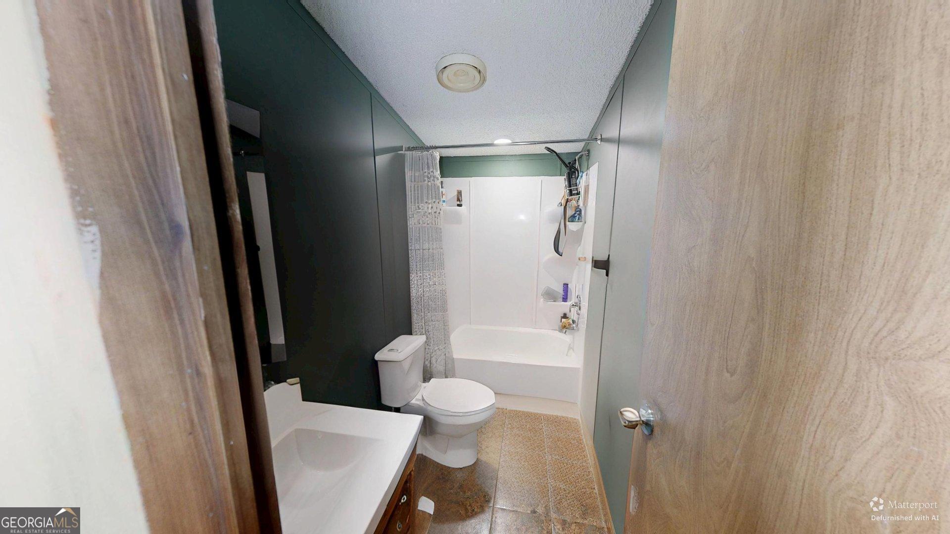 189 Boyd Valley Road Southeast Rome, GA 30161 - Photo 32 of 32 a bathroom with a shower and a toilet